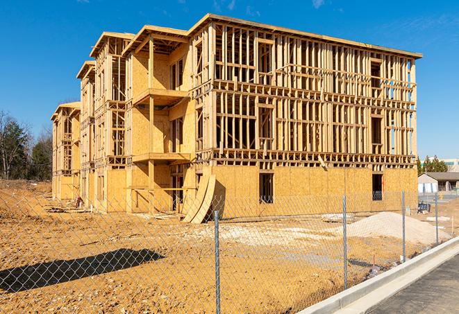 a snapshot of temporary chain link fences protecting a large construction project from unauthorized access in Land O Lakes, FL